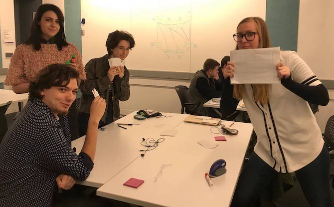 A group of students working together in a BFA Intro to Game Design course.